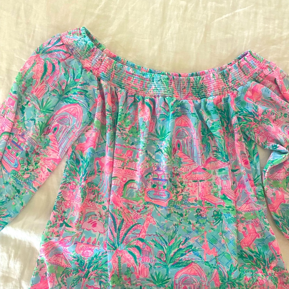 This lily Pulitzer blouse is work off the shoulder